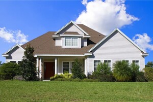Beautiful white home with large grassy yard